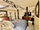 Cozy bedroom featuring a canopy bed, warm lighting, and a relaxing atmosphere at 4701 N Kings Hwy. # 19, Myrtle Beach, SC 29579