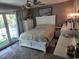 Bright bedroom with white furniture, an area rug, and a balcony with a view at 4701 N Kings Hwy. # 19, Myrtle Beach, SC 29579