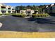 Well-maintained community entrance with lush landscaping, a central fountain, and paved road at 4701 N Kings Hwy. # 19, Myrtle Beach, SC 29579