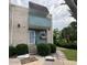 Inviting townhome facade with a cozy balcony, blooming window box, and well-kept garden area for added curb appeal at 4701 N Kings Hwy. # 19, Myrtle Beach, SC 29579