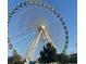 Myrtle Beach Ferris Wheel with colorful cars and blue sky at 4701 N Kings Hwy. # 19, Myrtle Beach, SC 29579