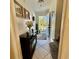 Charming foyer features tile flooring, a decorative table, and an inviting open door to the outside at 4701 N Kings Hwy. # 19, Myrtle Beach, SC 29579