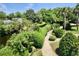 Beautifully landscaped property with lush greenery and a winding pathway, providing a peaceful and inviting atmosphere at 4701 N Kings Hwy. # 19, Myrtle Beach, SC 29579