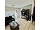 The living room offers tile floors and access to the backyard at 4701 N Kings Hwy. # 19, Myrtle Beach, SC 29579