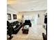 Inviting living area with tile floors, leather seating, and natural light from the sliding glass door at 4701 N Kings Hwy. # 19, Myrtle Beach, SC 29579