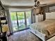 Bright bedroom features a sliding door to the balcony and a ceiling fan at 4701 N Kings Hwy. # 19, Myrtle Beach, SC 29579