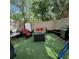Relaxing outdoor patio featuring comfortable seating, a grill, and lush artificial turf for easy maintenance and enjoyment at 4701 N Kings Hwy. # 19, Myrtle Beach, SC 29579