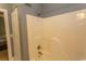 Standard bathroom, including basic shower stall; neutral paint with a view into the bedroom at 4823 Orchid Way # 2-203, Myrtle Beach, SC 29577