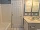 Functional bathroom with a clean vanity, bathtub, and tile flooring, exuding a fresh appeal at 4823 Orchid Way # 2-203, Myrtle Beach, SC 29577