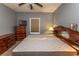 Comfortable bedroom featuring a ceiling fan, soft lighting, and classic wood furniture at 4823 Orchid Way # 2-203, Myrtle Beach, SC 29577