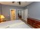 Cozy bedroom with ensuite bath featuring neutral walls and classic wood furniture at 4823 Orchid Way # 2-203, Myrtle Beach, SC 29577
