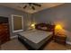 Comfortable bedroom featuring a ceiling fan, soft lighting, and classic wood furniture at 4823 Orchid Way # 2-203, Myrtle Beach, SC 29577