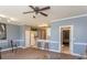 Open living space leading to kitchen and bathroom; lots of space, tile and carpet flooring, neutral paint at 4823 Orchid Way # 2-203, Myrtle Beach, SC 29577