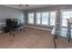 Spacious living room with large windows providing ample natural light and a cozy atmosphere at 4823 Orchid Way # 2-203, Myrtle Beach, SC 29577