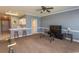 Inviting living room area with a modern TV setup, breakfast bar, and a view into the kitchen at 4823 Orchid Way # 2-203, Myrtle Beach, SC 29577