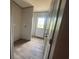 Hallway with door leading to back, wood-look flooring, and closet at 491 N Green Sea Rd., Loris, SC 29569