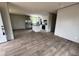Open-concept living space showcasing the kitchen with white cabinetry, stainless appliances, and center island at 491 N Green Sea Rd., Loris, SC 29569