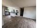 Open-concept living space showcasing the kitchen with white cabinetry, stainless appliances, and center island at 491 N Green Sea Rd., Loris, SC 29569