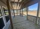 Covered porch featuring natural wood beams and railings with a view of the surrounding property at 491 N Green Sea Rd., Loris, SC 29569