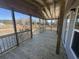 Spacious covered porch with wooden railings and flooring, offering an outdoor living space at 491 N Green Sea Rd., Loris, SC 29569