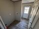 Utility room with washer/dryer hookups, storage, and an exterior door at 491 N Green Sea Rd., Loris, SC 29569