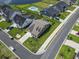 Aerial view of a neighborhood with well-manicured lawns, houses, and a street at 5000 Azul Loop, Myrtle Beach, SC 29579