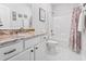 Bathroom with white cabinets, granite counters, shower/tub, and white tile floors at 5000 Azul Loop, Myrtle Beach, SC 29579