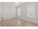 Bedroom with hardwood floors, bright natural light, and neutral paint at 5000 Azul Loop, Myrtle Beach, SC 29579