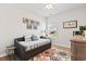 Bedroom features a daybed, colorful rug, and bright natural light from the window at 5000 Azul Loop, Myrtle Beach, SC 29579