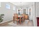 Bright dining room with natural light, wood flooring, and seating for six at 5000 Azul Loop, Myrtle Beach, SC 29579