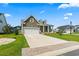 Charming two-story home featuring a two-car garage and a well-manicured front yard in a desirable neighborhood at 5000 Azul Loop, Myrtle Beach, SC 29579
