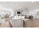 Open concept kitchen boasts granite countertops, a kitchen island with seating, and stainless appliances at 5000 Azul Loop, Myrtle Beach, SC 29579