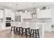 Bright kitchen with white cabinets, stainless steel appliances, and a large island with seating at 5000 Azul Loop, Myrtle Beach, SC 29579