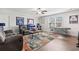 Spacious entertainment room with custom art, pool table, seating, and bright window at 5000 Azul Loop, Myrtle Beach, SC 29579