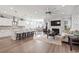 Open-concept living space featuring a modern kitchen, dining area, and cozy living room with fireplace at 5000 Azul Loop, Myrtle Beach, SC 29579