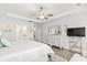 Bright main bedroom features stylish white furniture, decor, and plenty of space at 5000 Azul Loop, Myrtle Beach, SC 29579