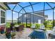 Relaxing screened porch with outdoor seating, dining area, and views of the backyard at 5000 Azul Loop, Myrtle Beach, SC 29579