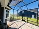 Well-lit screened-in porch providing view of the yard and nearby lake at 5000 Azul Loop, Myrtle Beach, SC 29579
