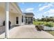 Charming backyard with a concrete patio, screened-in porch, and a beautifully landscaped garden bed for relaxation at 541 Miromar Way, Myrtle Beach, SC 29588