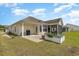 Lovely backyard featuring a patio area, screened-in porch, and lush greenery, great for outdoor entertaining at 541 Miromar Way, Myrtle Beach, SC 29588