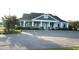 Exterior shot of the community clubhouse with ample parking and well-maintained grounds at 541 Miromar Way, Myrtle Beach, SC 29588