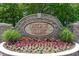 Stone community entrance sign surrounded by colorful landscaping and manicured flowerbeds at 541 Miromar Way, Myrtle Beach, SC 29588
