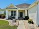 Inviting front porch with decorative plants, a seating area, and a well-maintained walkway at 541 Miromar Way, Myrtle Beach, SC 29588