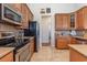 Updated kitchen with stainless steel appliances, granite countertops, and ample cabinet space for storage and organization at 541 Miromar Way, Myrtle Beach, SC 29588