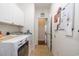 Convenient laundry room with a washer, dryer, storage cabinets, and a view of the home's interior at 541 Miromar Way, Myrtle Beach, SC 29588