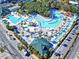 Aerial view of community water park including slides, lazy river, and various pool areas at 6001 - 1599 S Kings Hwy., Myrtle Beach, SC 29575