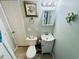Compact bathroom features a seashell picture, vanity, and marine life decor to create a pleasant space at 6001 - 1599 S Kings Hwy., Myrtle Beach, SC 29575
