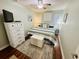 Comfortable bedroom featuring a queen bed, a chest, and a 