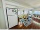 Open concept dining with adjacent refrigerator, bright windows and bar seating at 6001 - 1599 S Kings Hwy., Myrtle Beach, SC 29575
