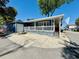 Blue beach house exterior featuring a spacious driveway at 6001 - 1599 S Kings Hwy., Myrtle Beach, SC 29575